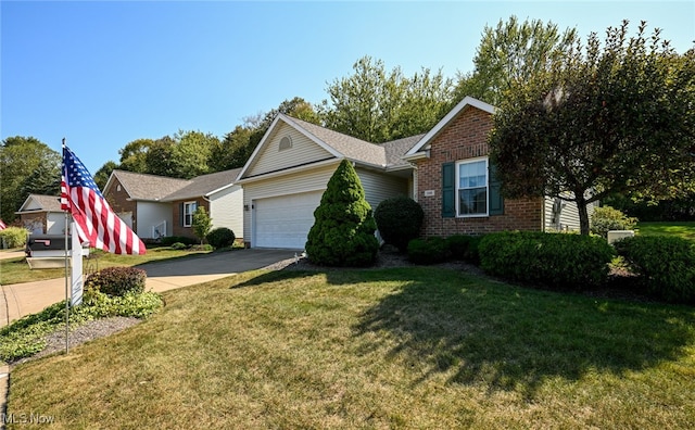 view of front of home featuring a front lawn and a garage