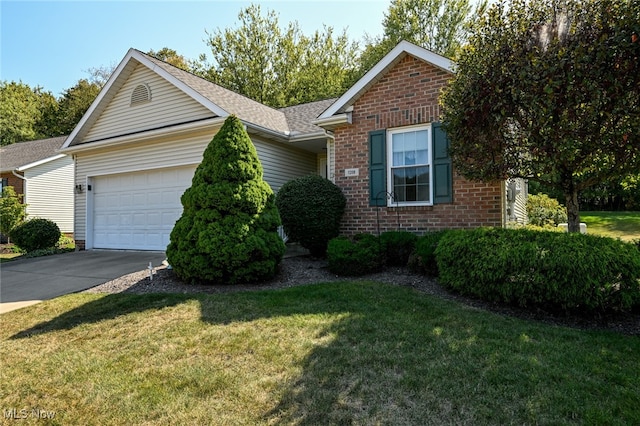 view of front of home featuring a garage and a front lawn