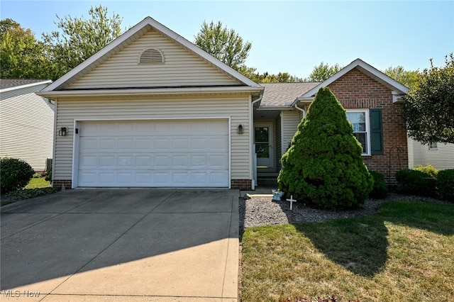 view of front facade featuring a garage and a front lawn