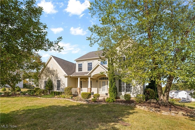 view of front of property featuring a porch and a front lawn