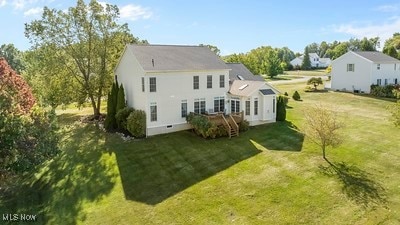 back of house with a yard