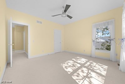 interior space with ceiling fan