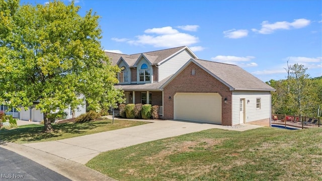 view of front of home featuring a garage and a front yard