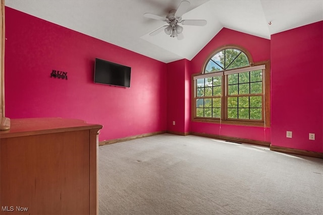 unfurnished living room with light carpet, vaulted ceiling, and ceiling fan