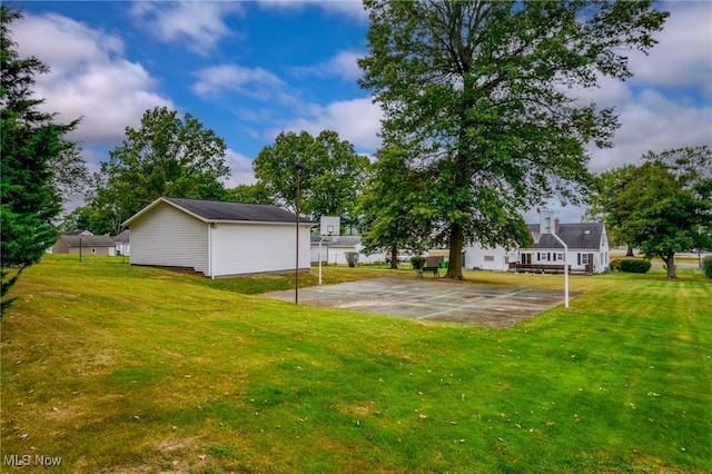 view of yard featuring basketball court