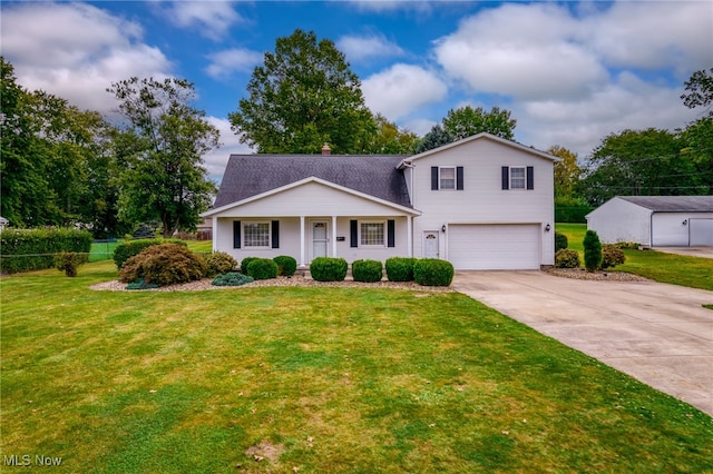 view of front of property featuring a garage and a front yard