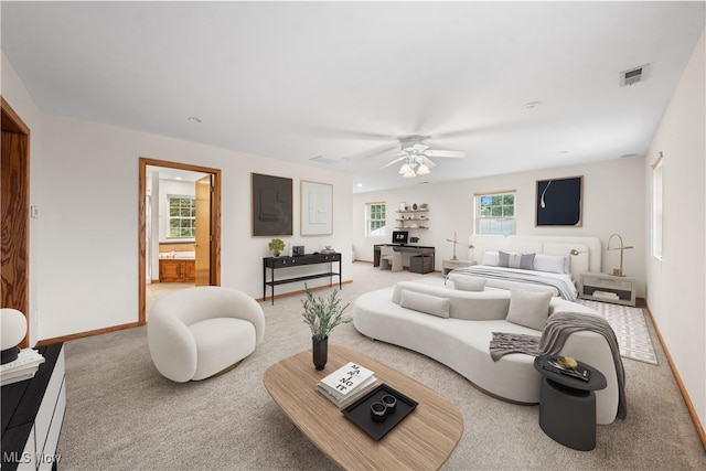 carpeted living room featuring ceiling fan