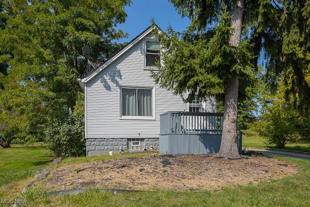 view of side of property with a yard