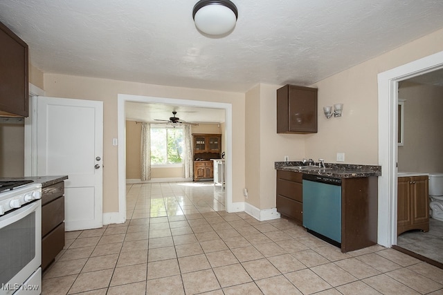 kitchen with ceiling fan, dark brown cabinetry, light tile patterned flooring, dishwasher, and white stove