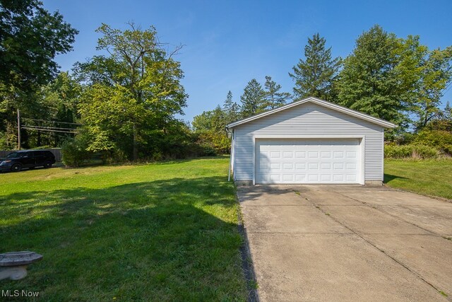 garage featuring a yard