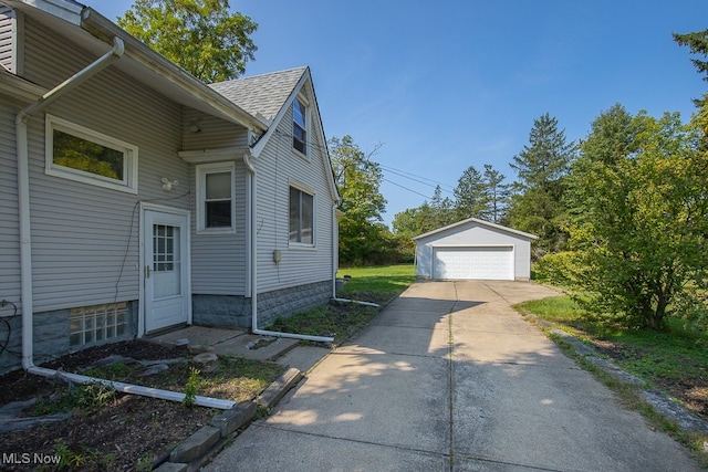 view of property exterior with an outbuilding and a garage