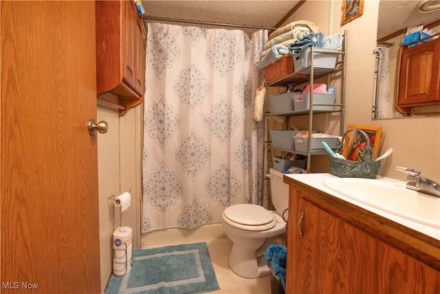 full bathroom featuring shower / bath combination with curtain, a textured ceiling, vanity, and toilet