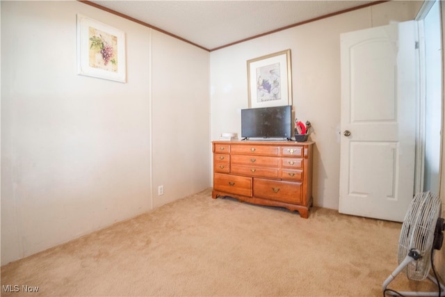 bedroom featuring light carpet and ornamental molding