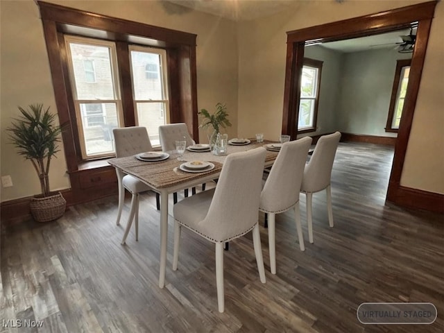 dining space with ceiling fan, dark hardwood / wood-style floors, and a healthy amount of sunlight