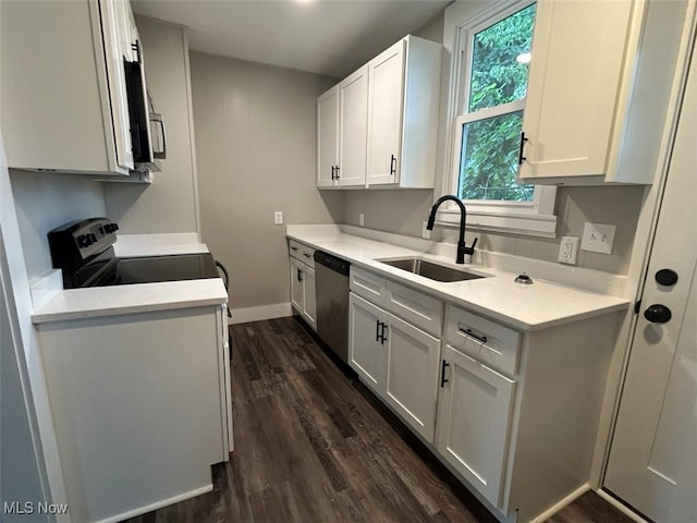 kitchen with appliances with stainless steel finishes, dark wood-type flooring, sink, and white cabinetry