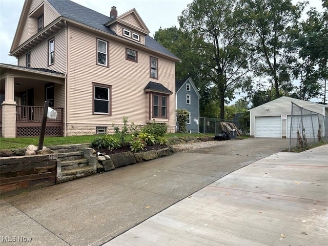 view of front of house featuring an outbuilding and a garage