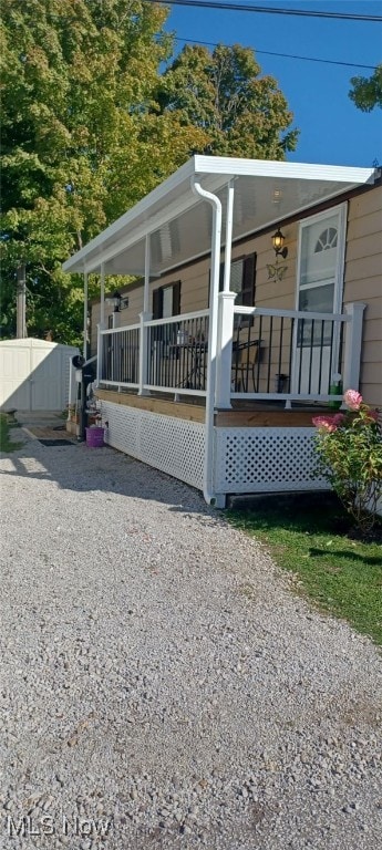 back of house with a porch