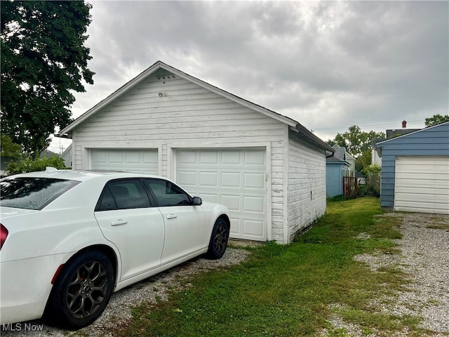 garage featuring a yard