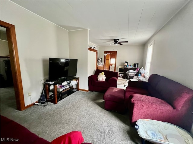 carpeted living room featuring ceiling fan