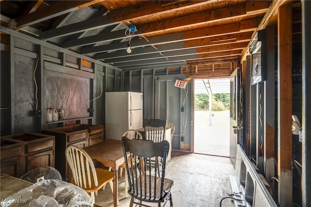 basement with white refrigerator