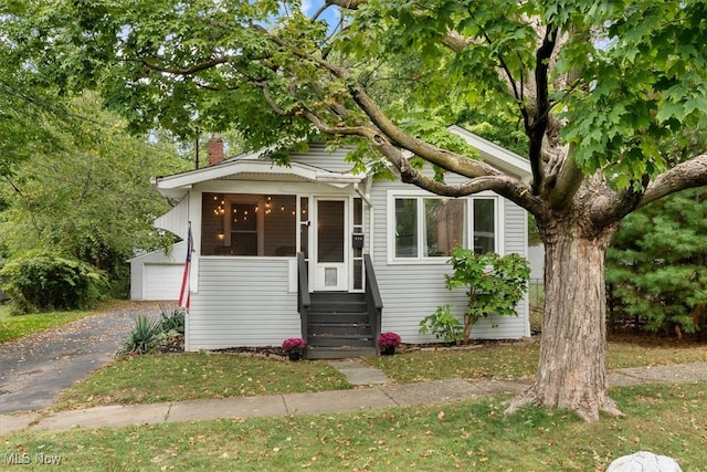 view of front of house featuring an outbuilding and a garage