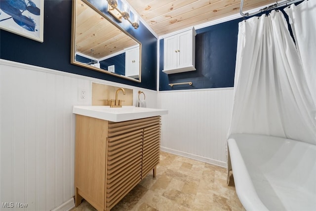 bathroom with vanity, shower / bath combo with shower curtain, and wooden ceiling