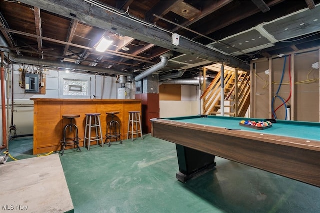 rec room with electric panel, concrete floors, pool table, bar area, and water heater