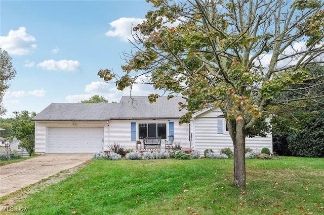 view of front of property with a front lawn and a garage