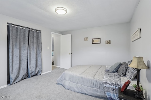 bedroom with light colored carpet