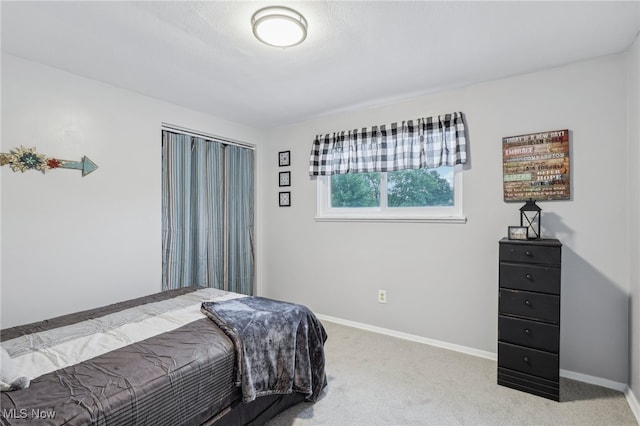 bedroom with light carpet