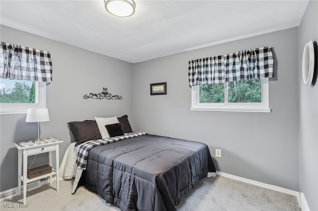 bedroom with light carpet