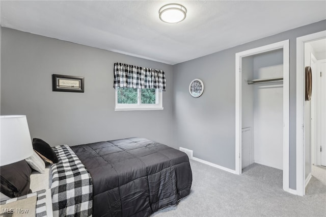 carpeted bedroom with a closet