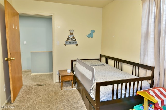 bedroom with light colored carpet