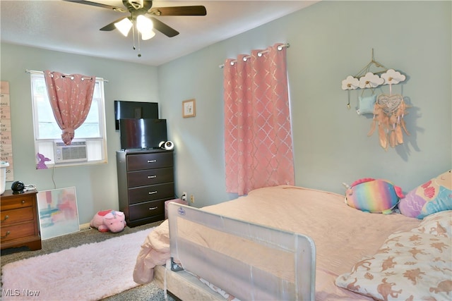 bedroom with cooling unit, carpet flooring, and ceiling fan