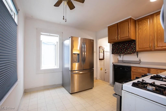 kitchen featuring stainless steel refrigerator with ice dispenser, ceiling fan, black dishwasher, and gas range gas stove