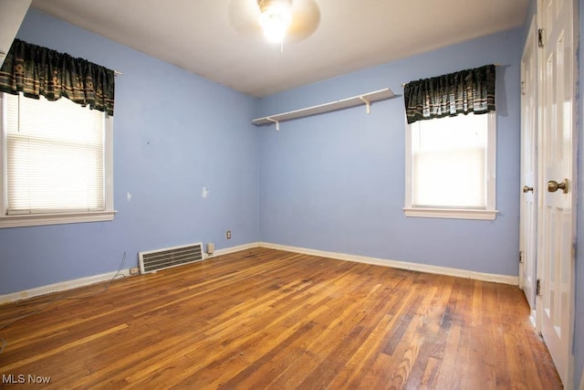 spare room featuring hardwood / wood-style floors