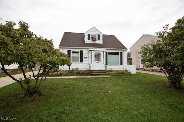 cape cod house with a front lawn