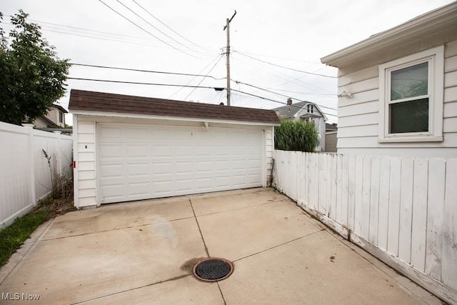 garage featuring wood walls