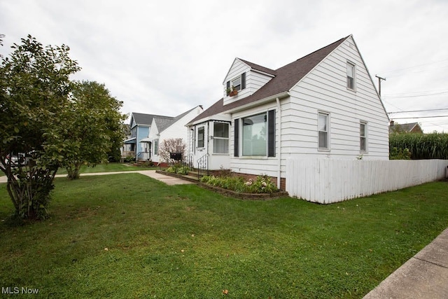 view of home's exterior featuring a yard