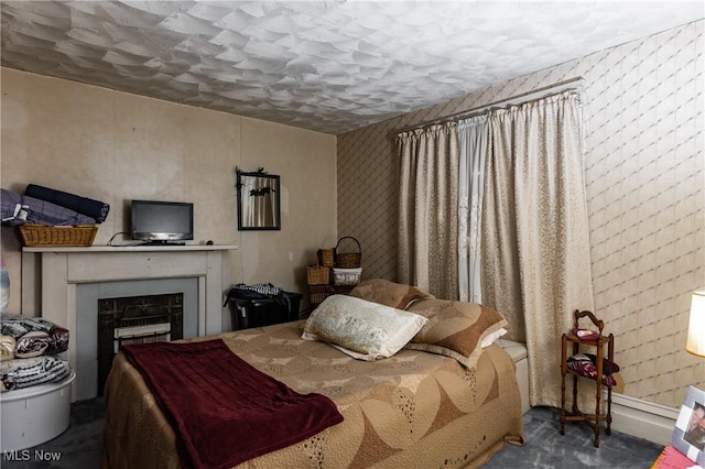 1808 Covert St, Parkersburg, WV 26101 - carpeted bedroom featuring a fireplace and wallpapered walls