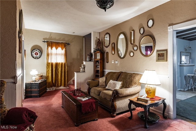 living room featuring dark carpet