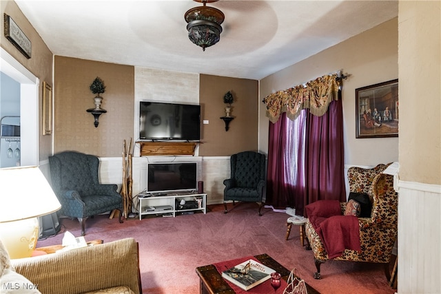 living room featuring carpet flooring and ceiling fan