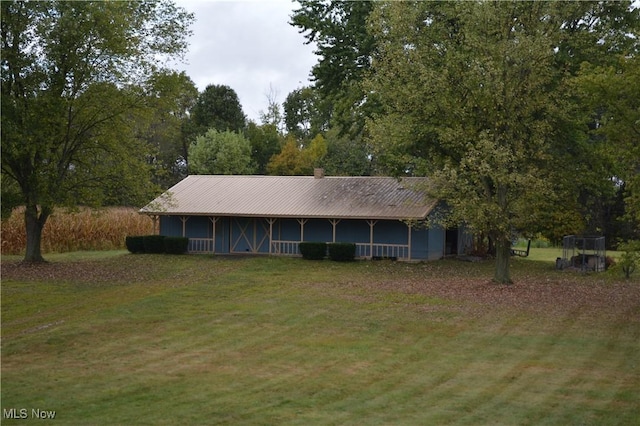 exterior space with a yard