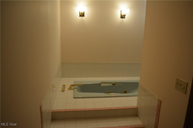 bathroom with tiled bath