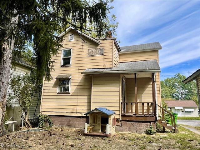 rear view of house with a porch