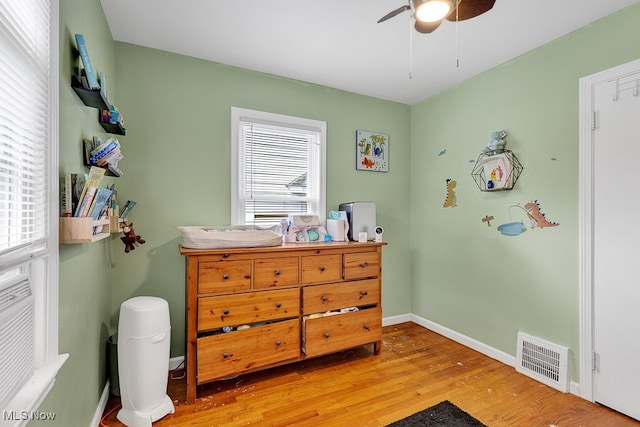 bedroom with wood-type flooring and ceiling fan