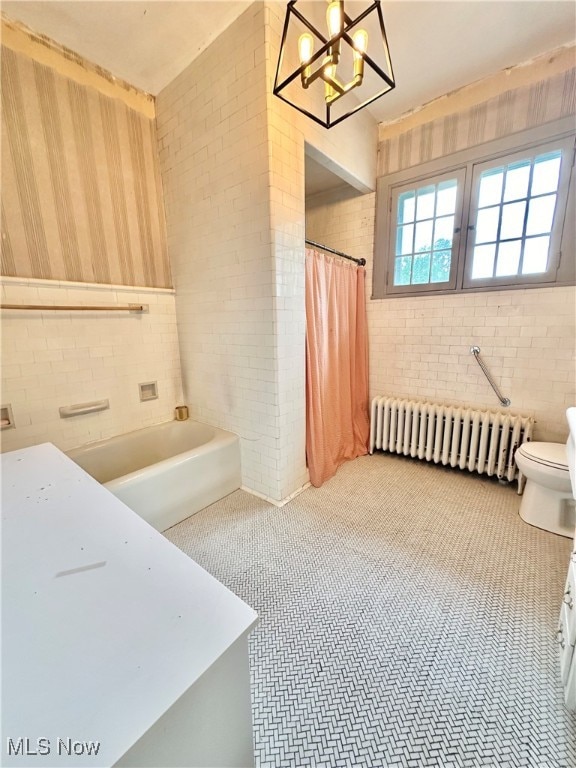 bathroom with shower / tub combo with curtain, radiator, toilet, and brick wall