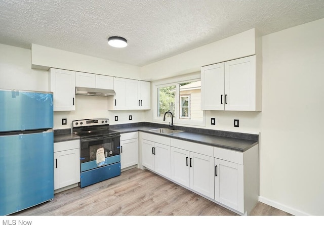 kitchen featuring white cabinetry, stainless steel refrigerator, electric range oven, light wood-type flooring, and sink