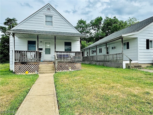 bungalow-style home featuring a front lawn and covered porch