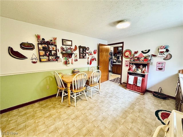 dining area with a textured ceiling